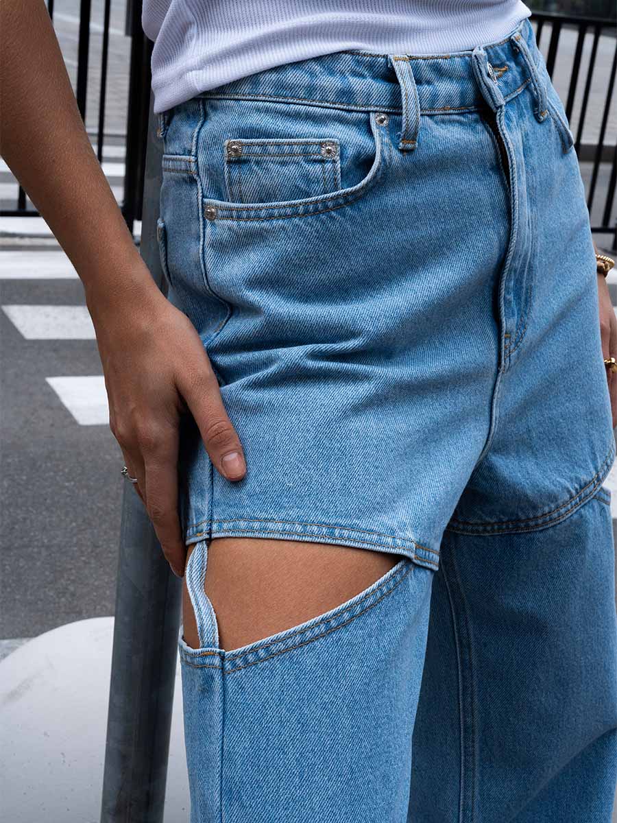 Blue jeans with cut-outs on the hips