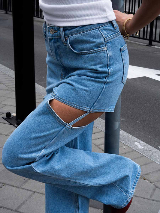 Blue jeans with cut-outs on the hips